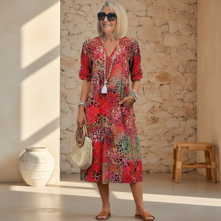 Women's vibrant patterned midi dress with flowing silhouette, perfect for summer casual chic or elegant occasion wear.