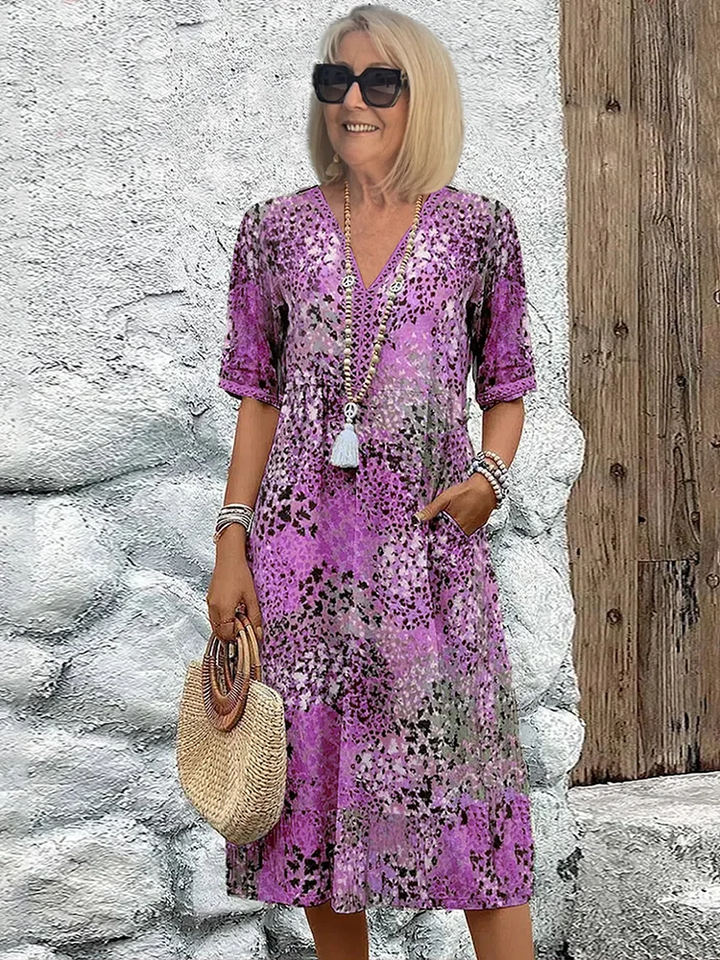 Summer-ready women's vibrant patterned midi dress. Effortless elegance with a colorful print & comfortable fit.