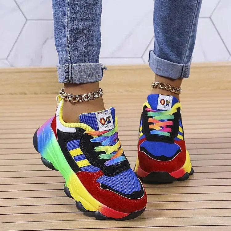 Women's vibrant rainbow platform sneakers with comfortable wide fit and stylish lace-up design for everyday wear.