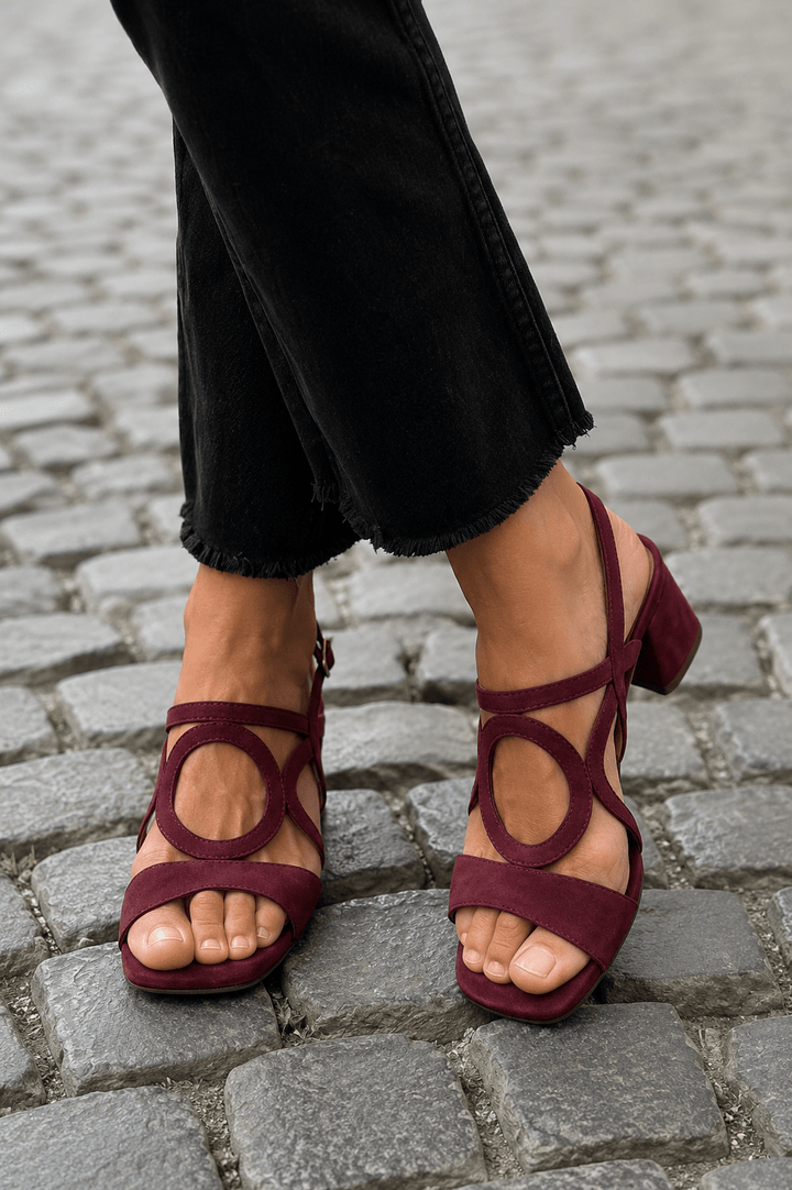 Women's vibrant summer heeled sandals, modern design with bold circular details.