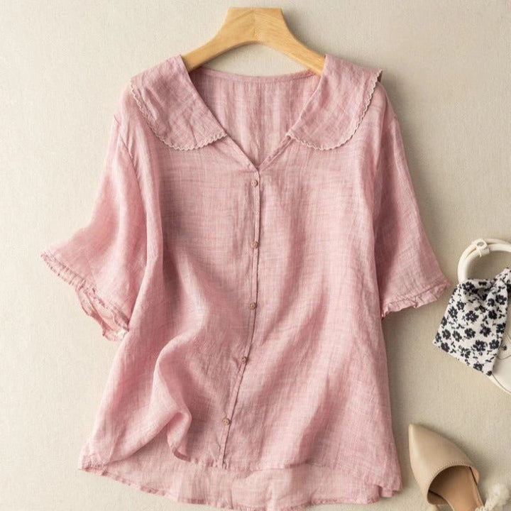 Elegant women's vintage top featuring button detailing & a relaxed fit, ideal for versatile everyday fashion.