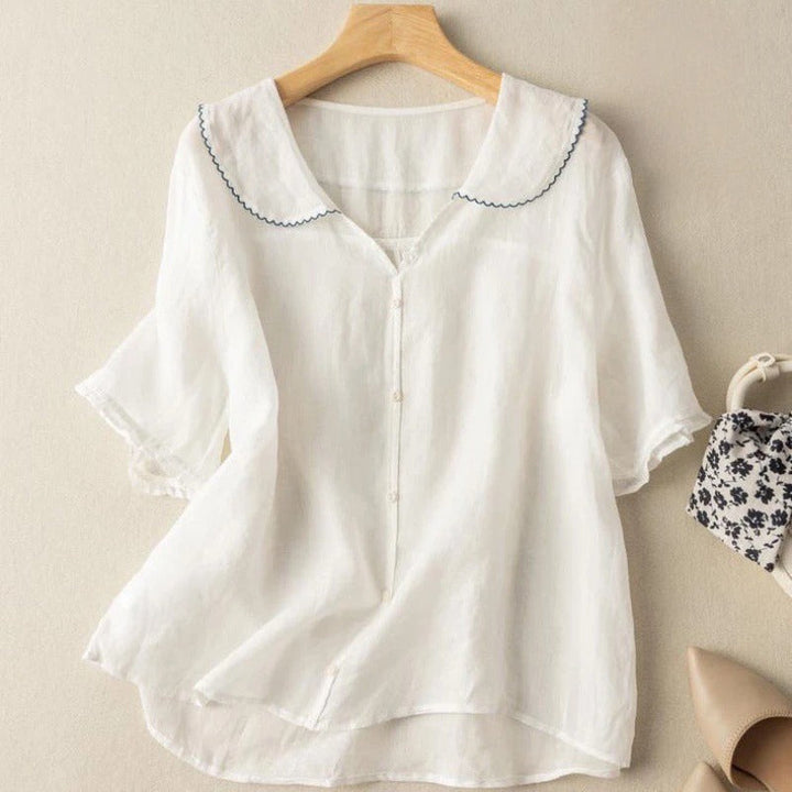 Chic women's vintage blouse with classic button accents, perfect for effortless style and casual elegance.