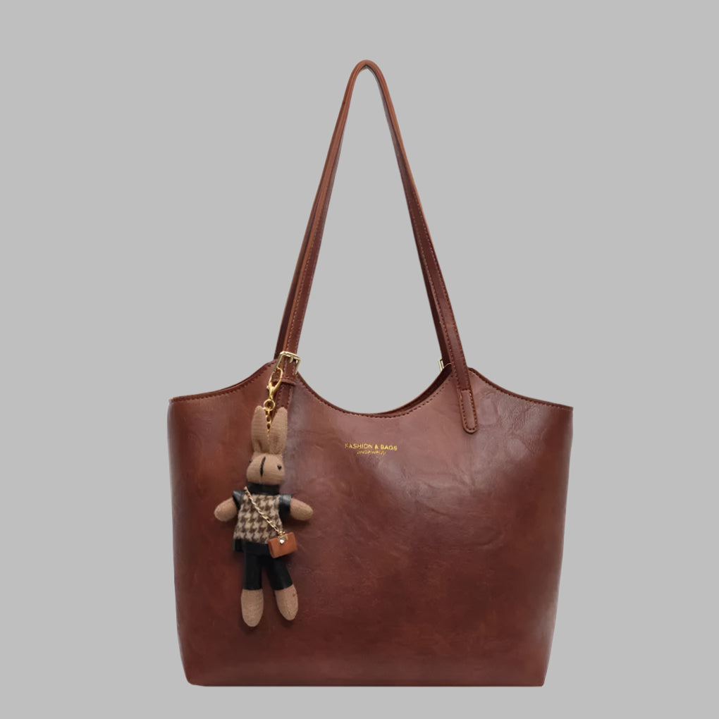 Women's vintage brown leather tote shoulder bag, perfect for everyday style. Classic and fashionable handbag accessory.
