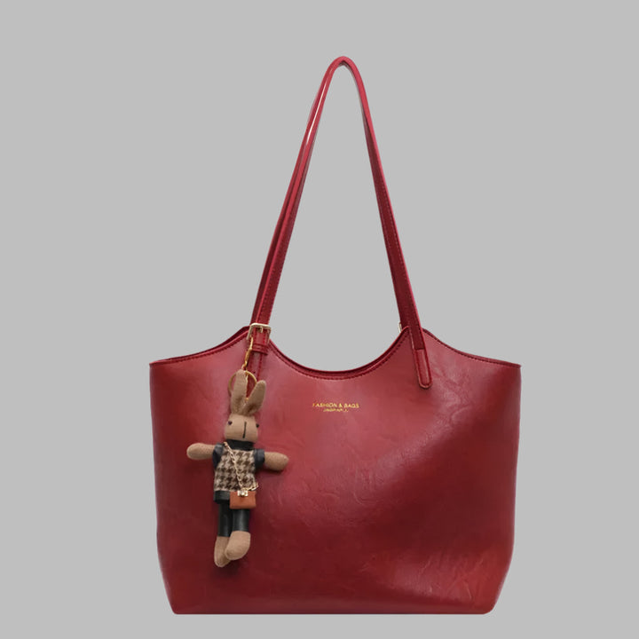 Classic vintage leather women's shoulder tote bag. A fashionable everyday handbag accessory for women.