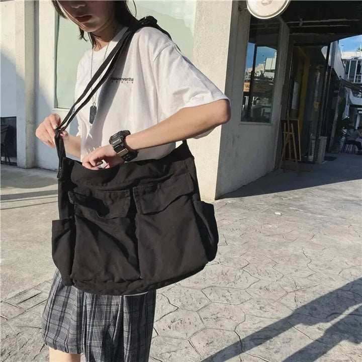 Stylish women's vintage canvas handbag. Multi-pocket design, perfect as a durable crossbody or tote bag.
