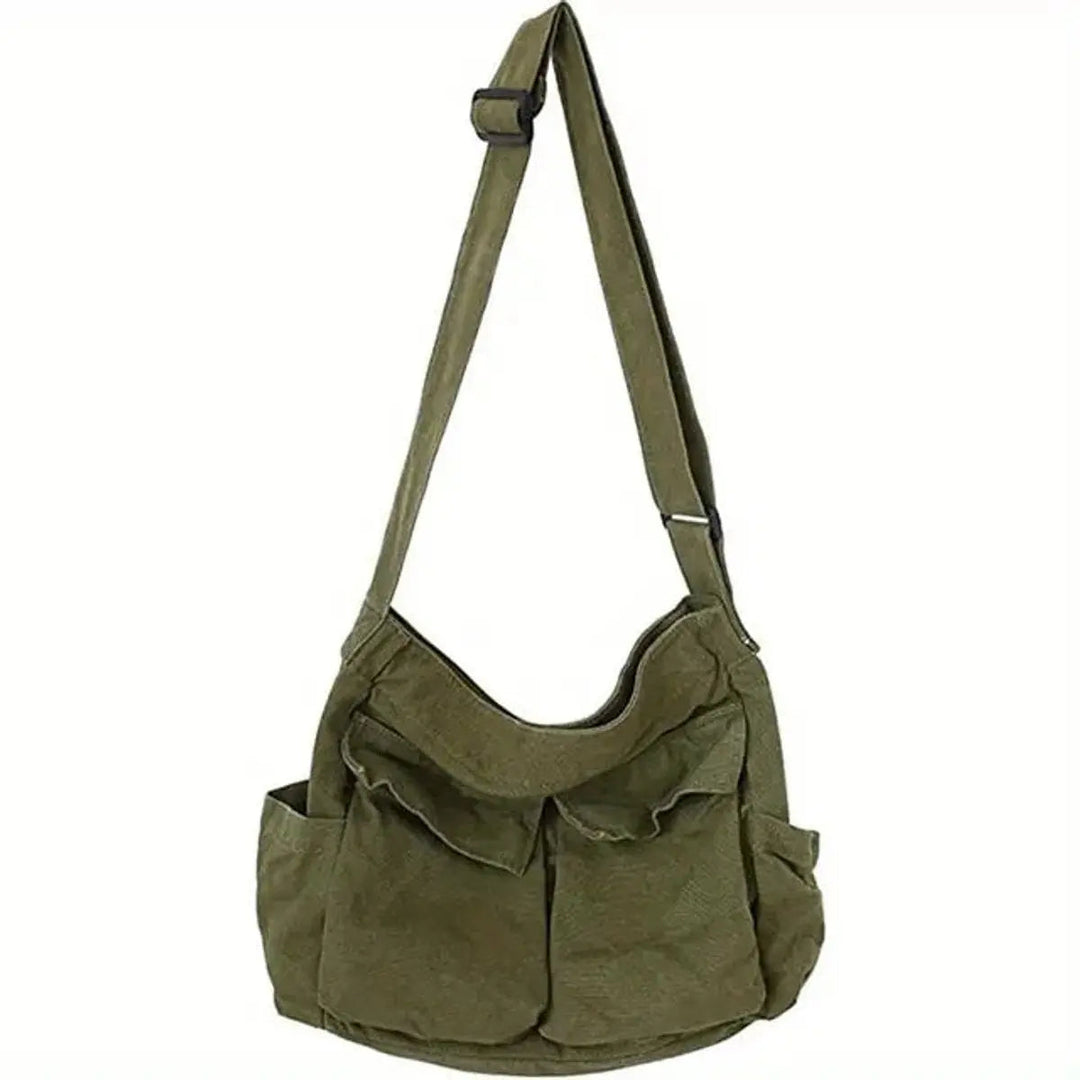 Vintage-style canvas women's crossbody tote bag. Multi-pocket design, durable and versatile for casual outings.