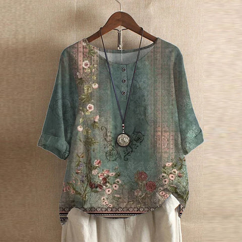 Women's vintage floral print blouse, shortsleeve & roundneck. Effortless casual fashion top.