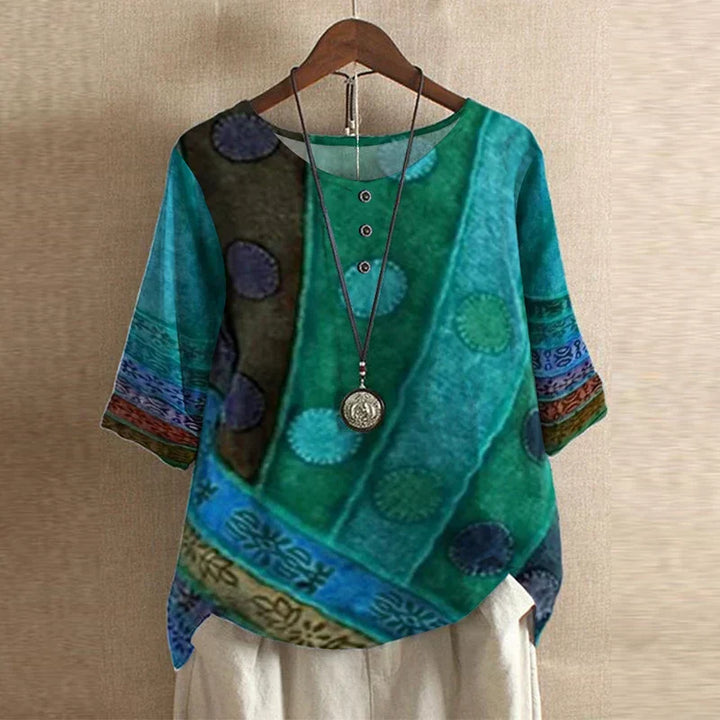 Stylish women's vintage floral print top. Roundneck, shortsleeve, and relaxed fit blouse.