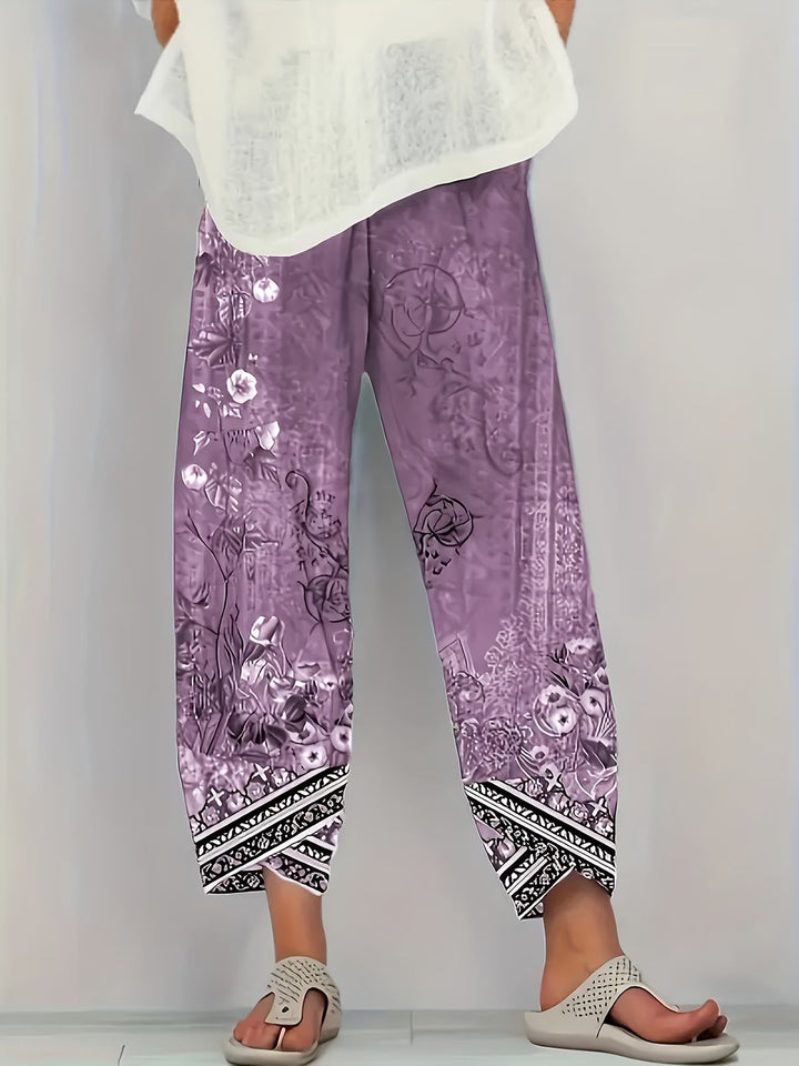 Flowy women's vintage floral trousers in a relaxed fit, ideal for breathable spring and summer fashion.