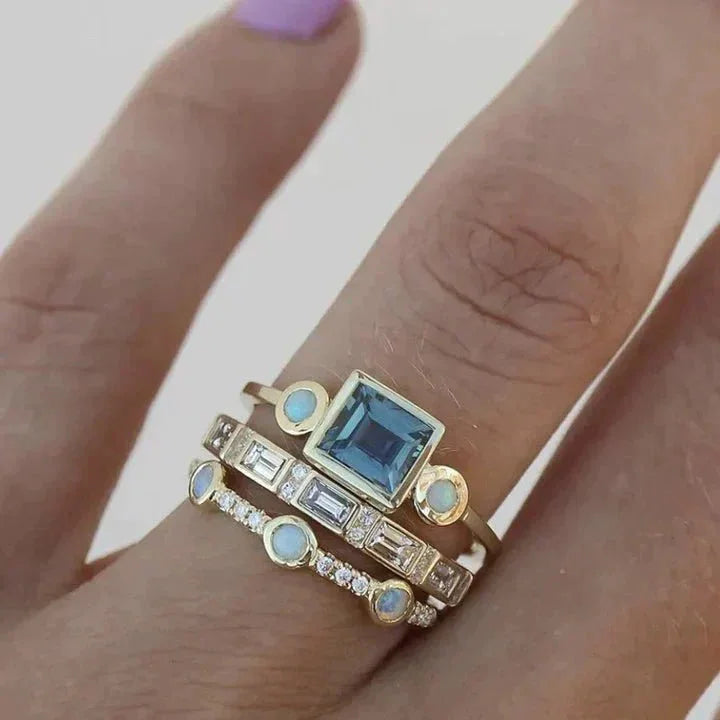 Women's vintage gold-tone stackable ring set with sparkling mixed crystals, perfect for elegant layering.