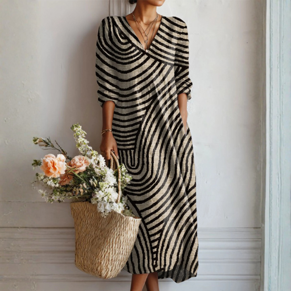 Women's vintage midi dress featuring a unique abstract art print, perfect for an elegant summer look. Flowy & comfortable.