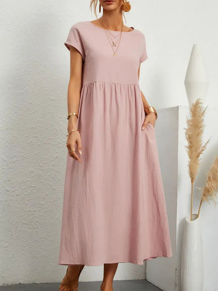 Relaxed fit vintage O-neck casual dress for women, ideal for comfortable summer day wear.