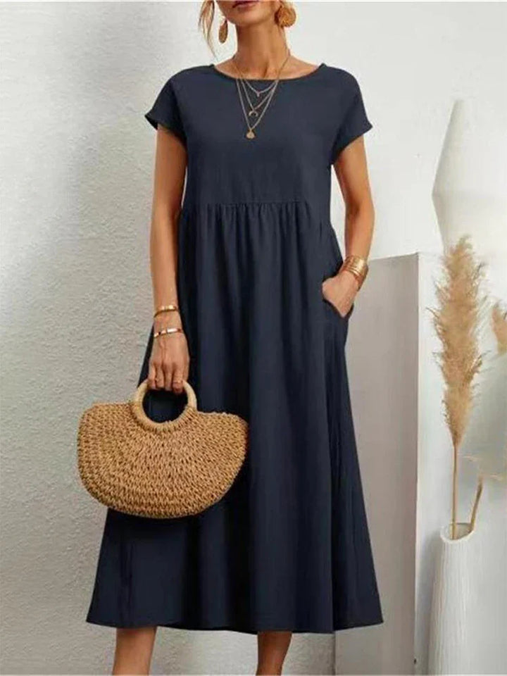 Sophisticated vintage O-neck women's dress, versatile for casual and elegant summer style.