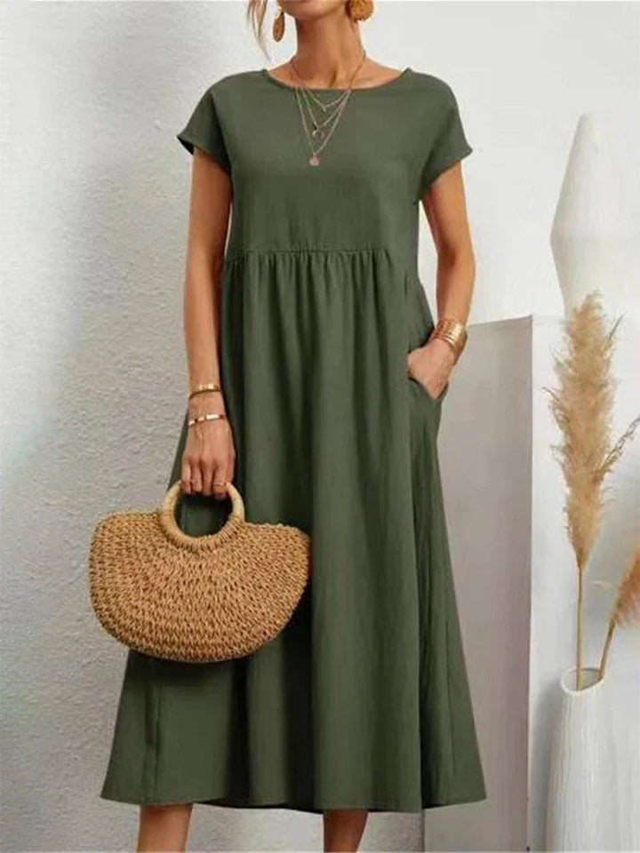 Feminine vintage O-neck summer dress, women's classic casual apparel for versatile everyday style.