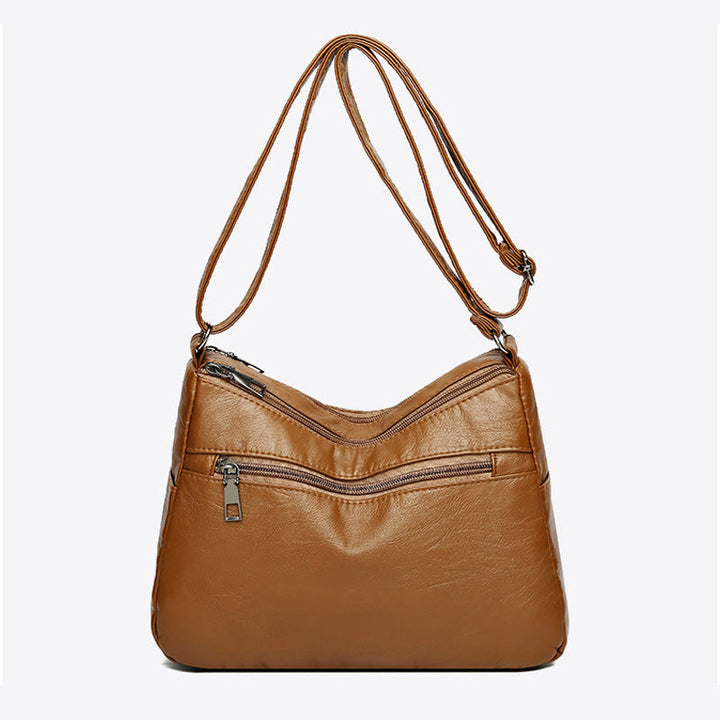 Essential women's vintage shoulder bag. A relaxed everyday fashion accessory for modern style.
