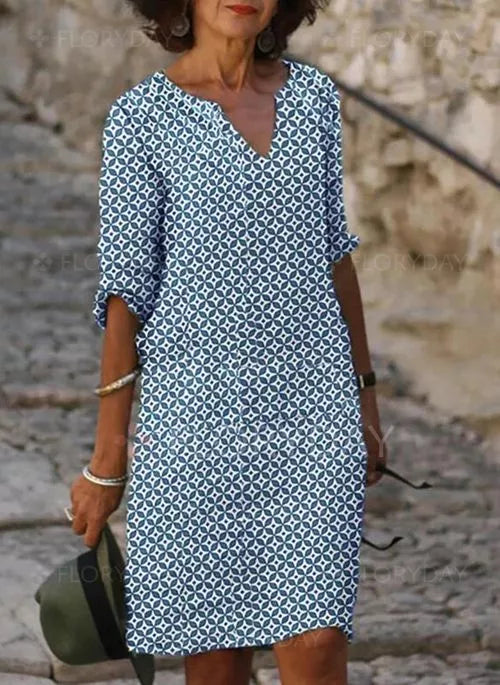 Casual flowy midi dress for women featuring a stylish split-neck, perfect for summer vacations & elegant spring looks.
