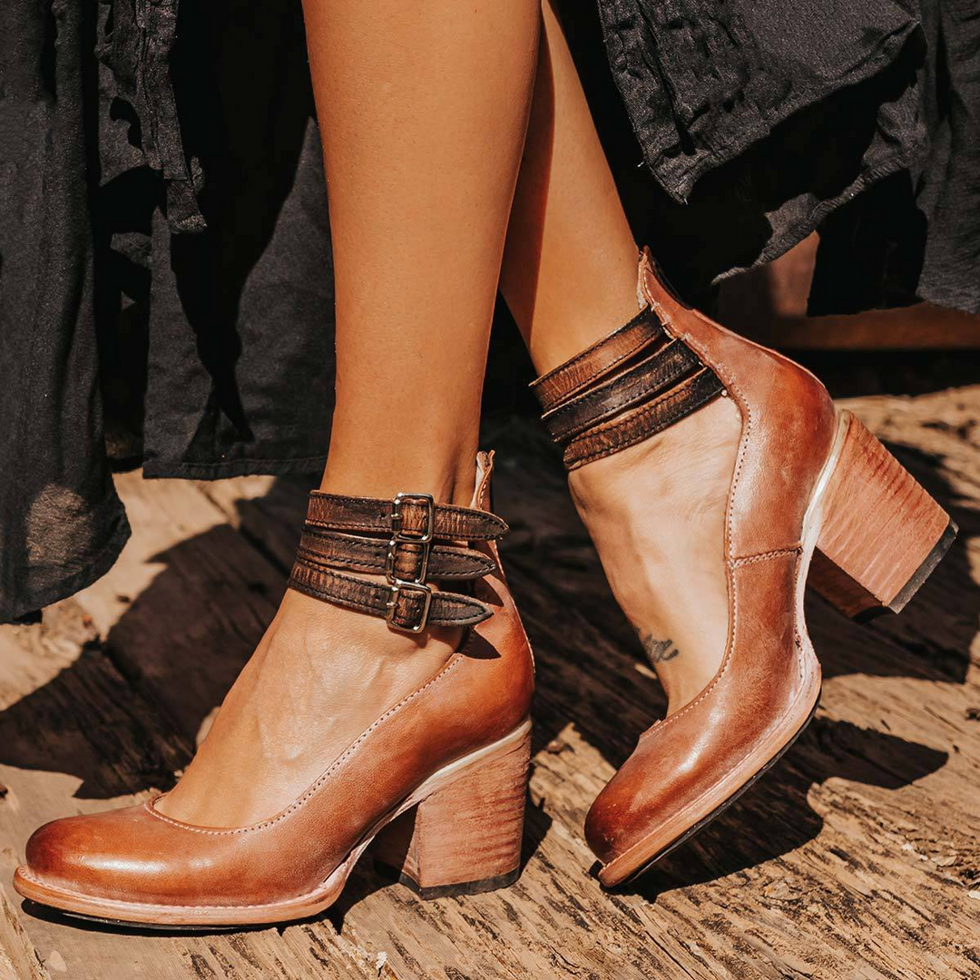 Womens casual footwear: vintage strappy block heel sandals with a delicate ankle strap.