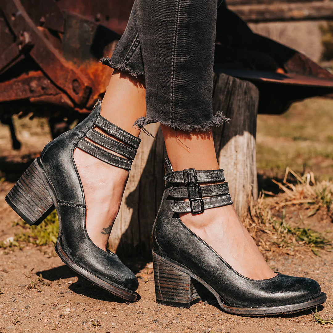 Classic women's retro strappy heels with a secure ankle strap, perfect for dressy occasions.