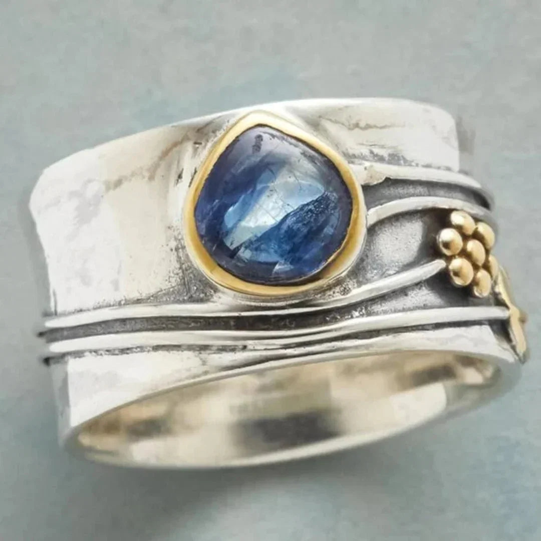 Women's vintage two-tone blue tear-drop stone ring with gold accents, an elegant fashion jewelry statement ring.