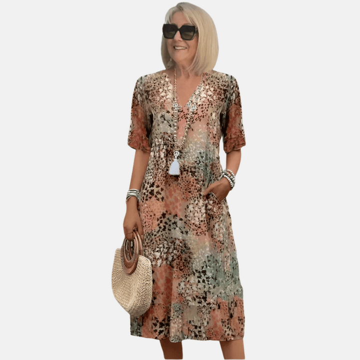 Women's vintage v-neck loose fit summer dress. Perfect casual knee-length sundress for spring and vacation.