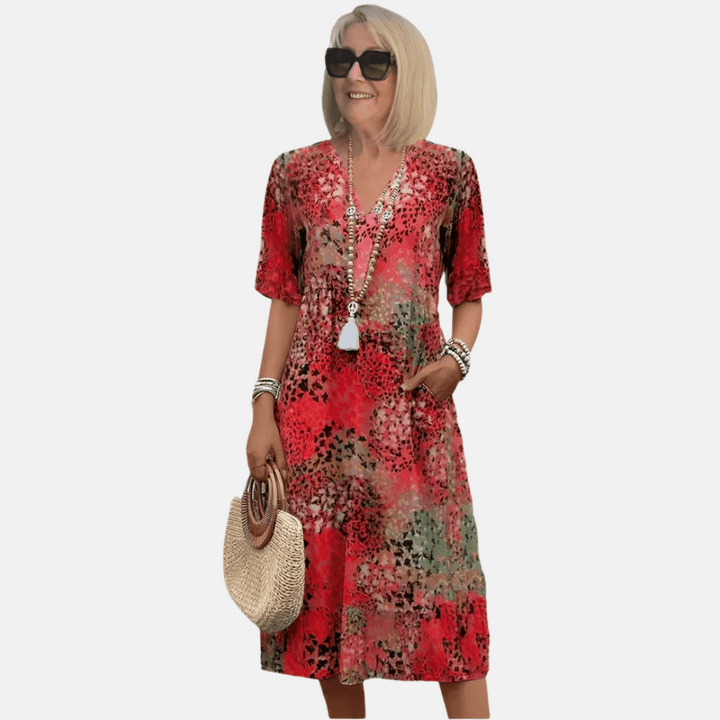 Knee-length women's loose fit v-neck casual dress. Short sleeve a-line design, perfect for summer beach vacations.
