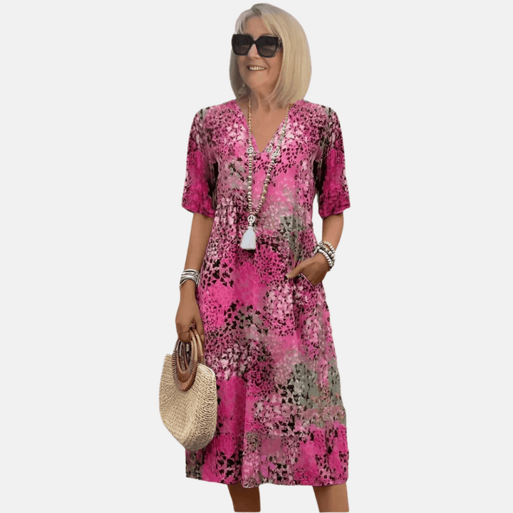 Chic women's loose fit v-neck summer dress. Vintage-inspired, comfortable casual sundress with short sleeves.