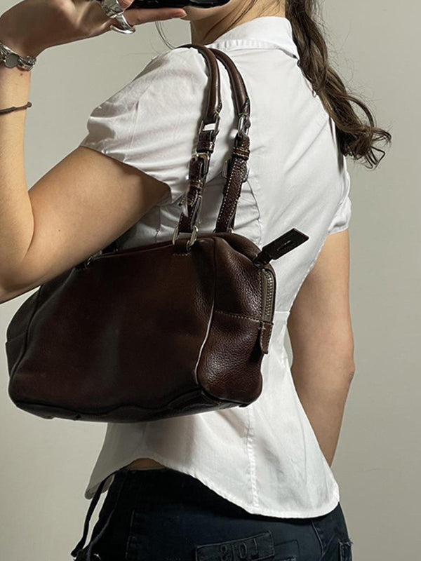 Tailored women's vintage short sleeve V-neck top with a feminine silhouette