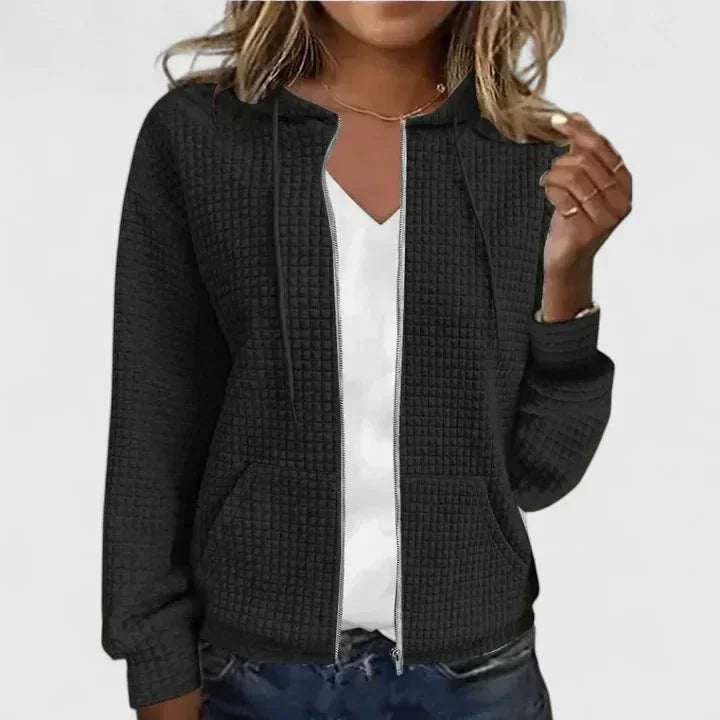 Comfortable women's full-zip hooded cardigan featuring a cozy waffle knit texture and practical pockets.