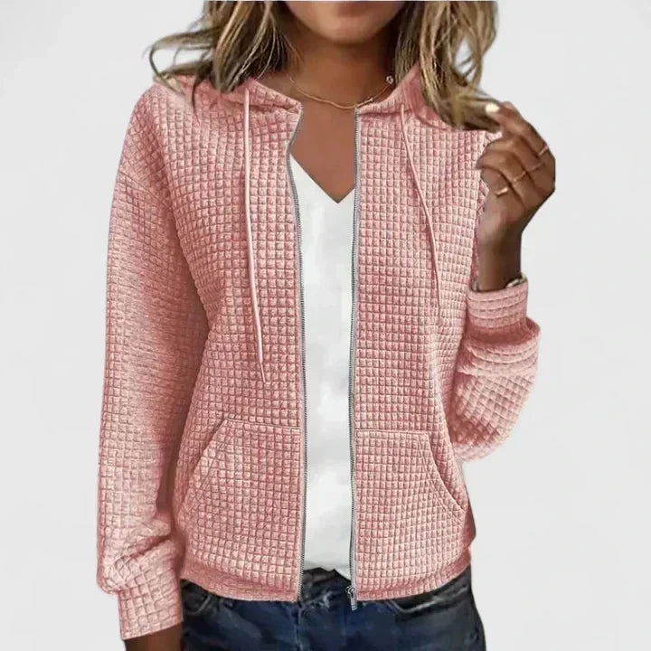 Stylish women's waffle knit hooded sweater with full zip-front and deep pockets, ideal for casual layering.