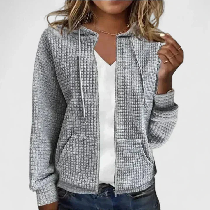 Versatile women's full-zip hooded cardigan in waffle knit, perfect for outerwear or layering, with pockets.
