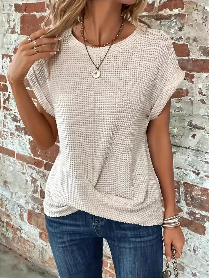 Stylish women's short sleeve waffle knit top, designed with a chic front twist, ideal for daily wear.
