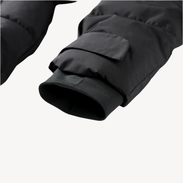 Warm women's hooded puffer jacket with a stylish belt. Black quilted winter coat for cozy cold weather outerwear.