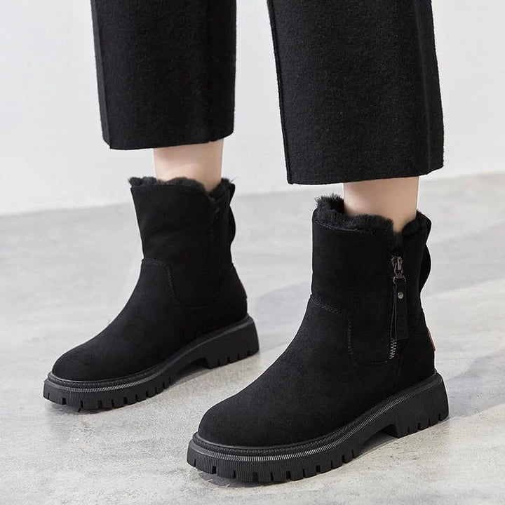 Casual women's slip-on ankle boots with a chunky sole, ideal for everyday winter wear and warmth.