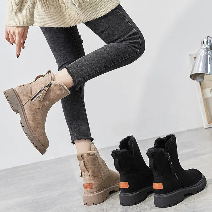 Fleece-lined women's slip-on ankle boots, offering warmth and comfort for cold weather and casual outings.