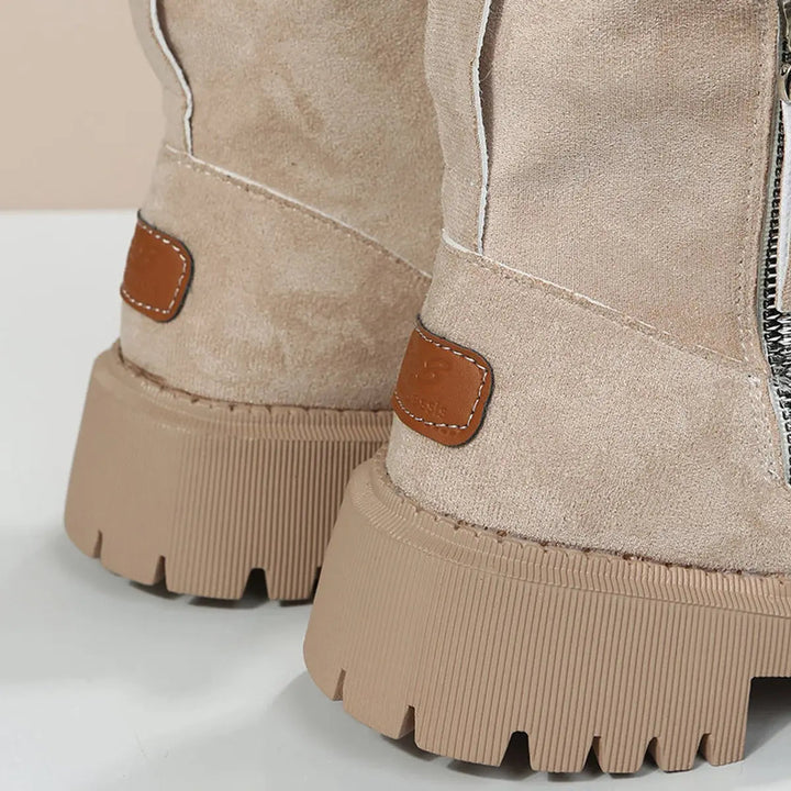 Easy slip-on women's ankle boots, fleece-lined for warmth and comfort, featuring a trendy chunky sole.