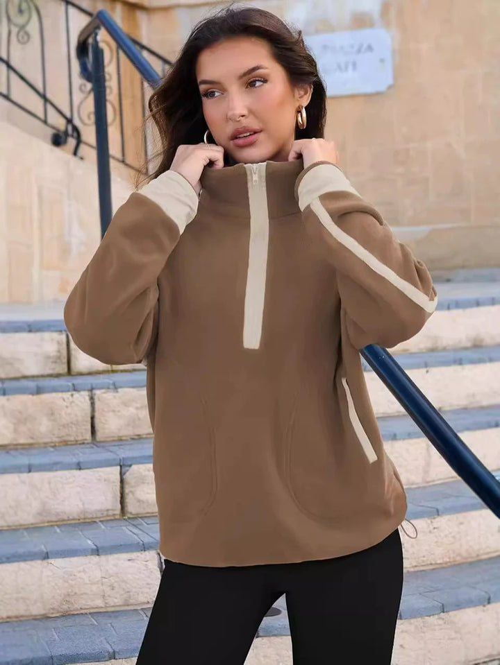 Women's warm quarter-zip pullover. Soft, comfortable long sleeve top for casual wear.