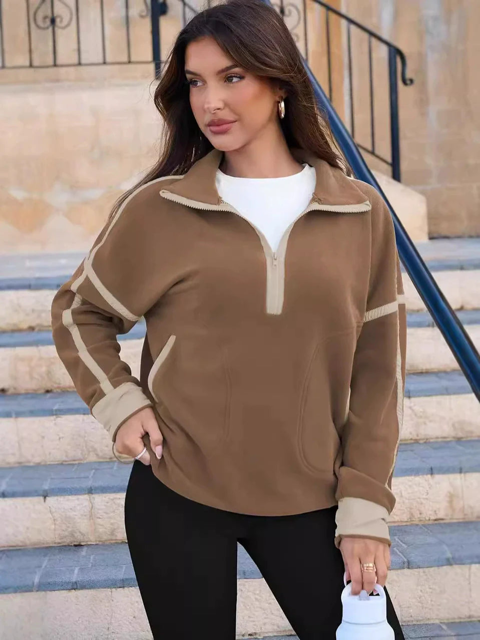 Warm women's quarter-zip pullover, a versatile layering piece for stylish everyday wear.