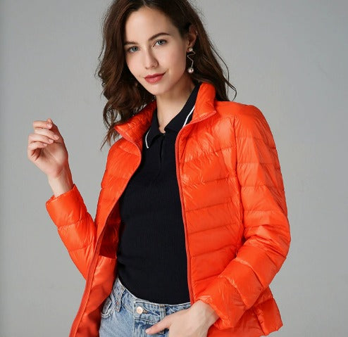 Women's warm quilted puffer jacket with long sleeves, perfect for winter comfort and style.