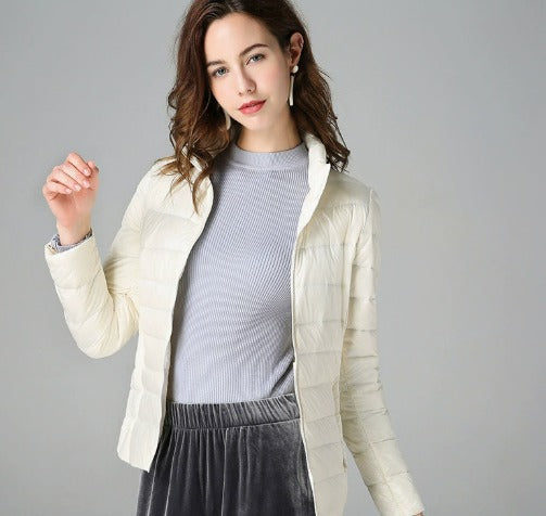 Cozy women's long sleeve quilted puffer jacket, warm outerwear ideal for cold fall and winter days.