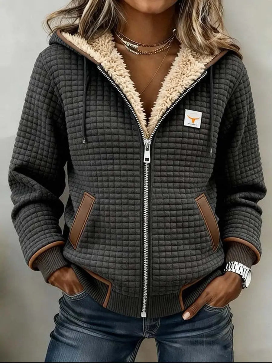 Women's warm quilted winter jacket with cozy Sherpa fleece lining, perfect for cold weather style and comfort.