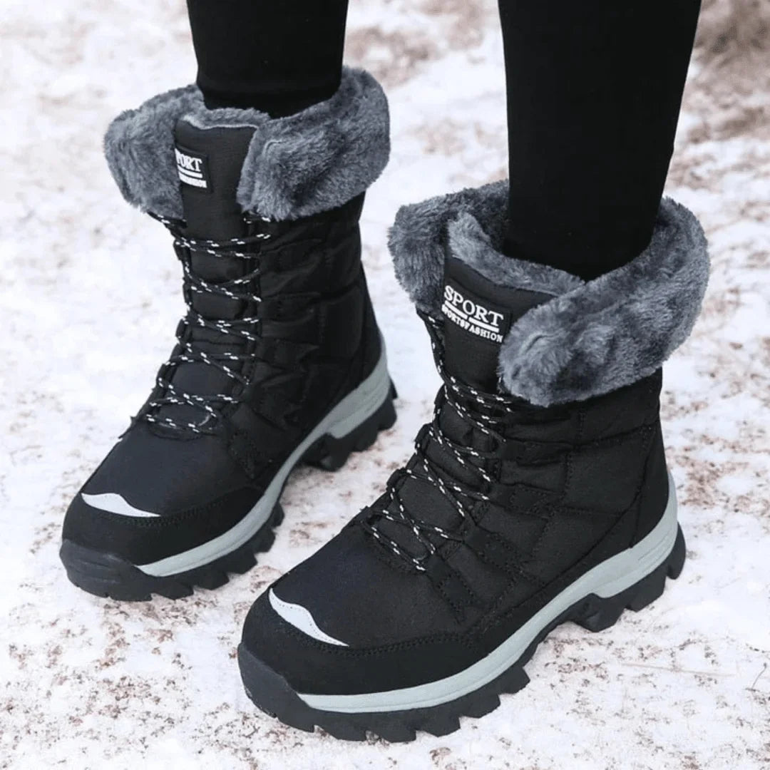 Stylish women's fur-lined winter boots with waterproof design, quilted upper, and lace-up closure for snow.