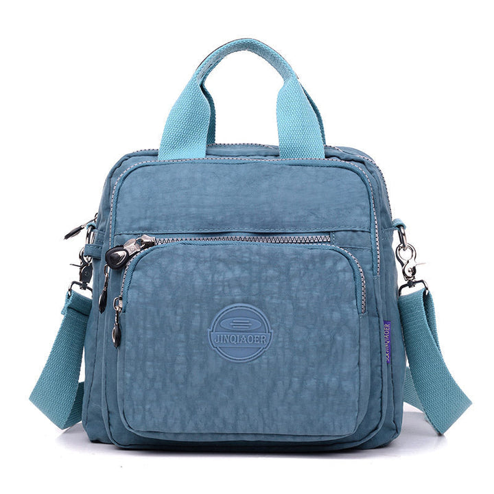 Women's water-resistant shoulder bag, convertible to crossbody. Perfect purse for versatile wear.