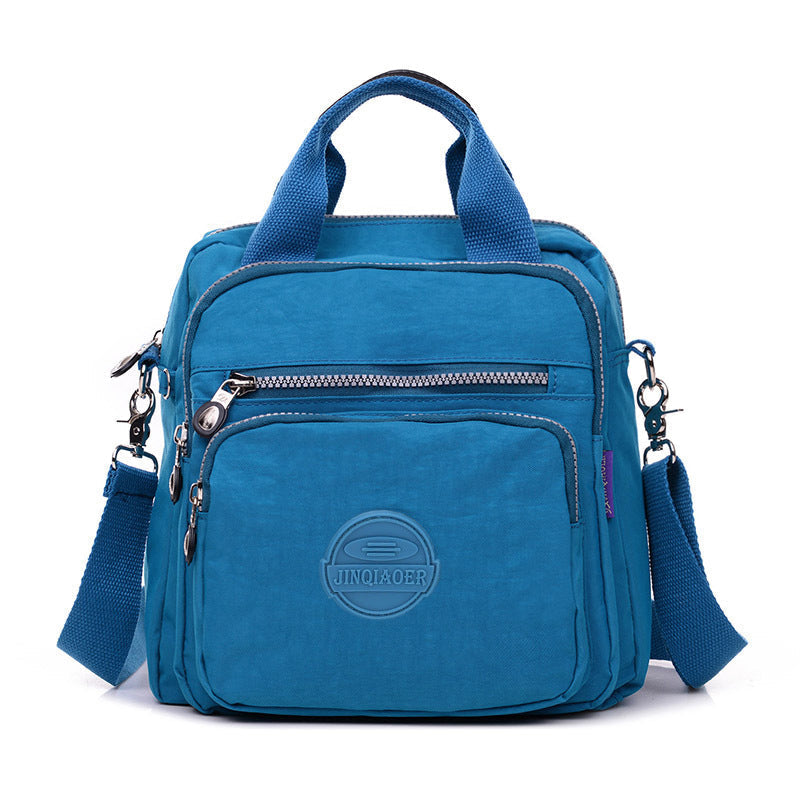 Compact water-resistant women's crossbody bag. Spacious enough for daily essentials, travel-ready.