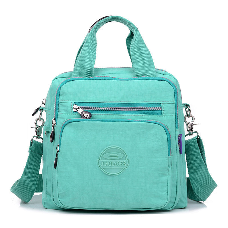 Durable water-resistant fabric on a women's versatile crossbody purse. Built for daily & travel use.