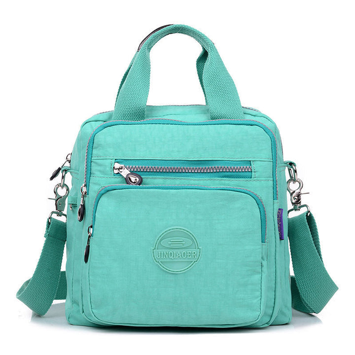 Durable water-resistant fabric on a women's versatile crossbody purse. Built for daily & travel use.