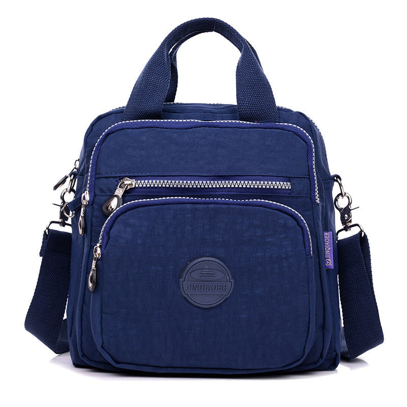 Modern women's water-resistant crossbody bag, a versatile fashion accessory for travel & daily use.