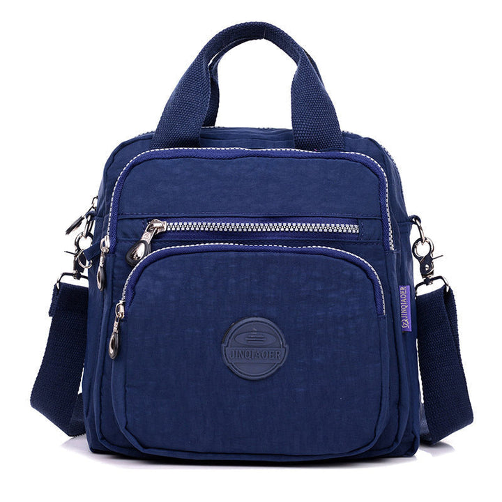 Modern women's water-resistant crossbody bag, a versatile fashion accessory for travel & daily use.