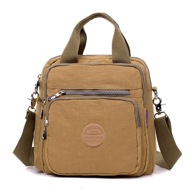 Multifunctional women's water-resistant crossbody bag, a durable travel and daily essential organizer.