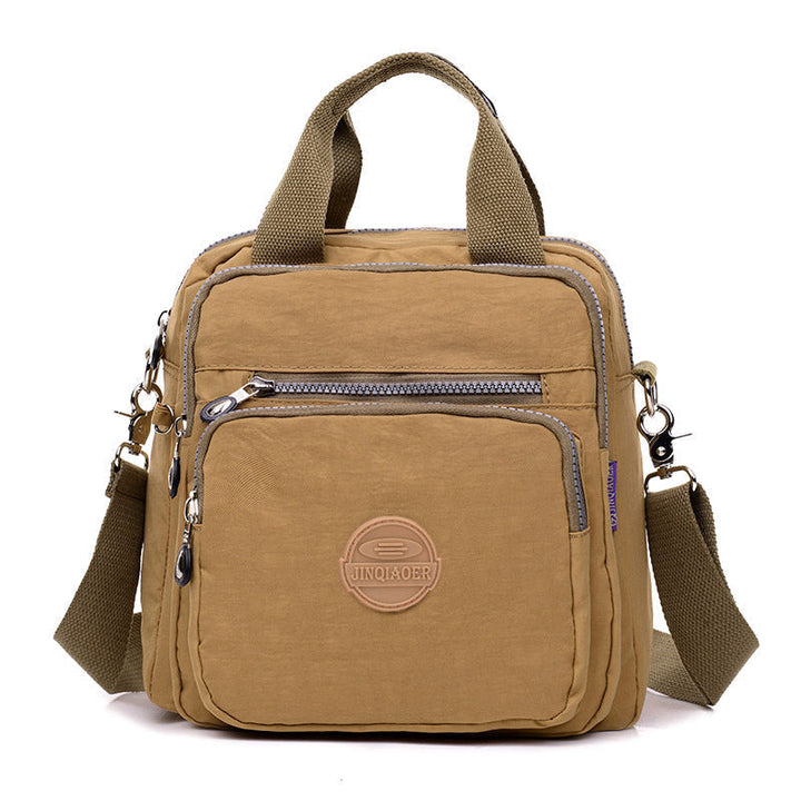 Multifunctional women's water-resistant crossbody bag, a durable travel and daily essential organizer.