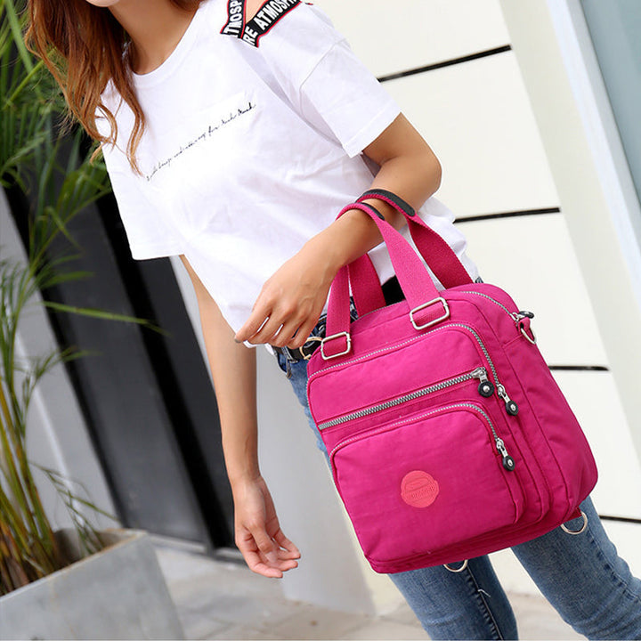 Stylish women's water-resistant crossbody bag, ideal for all weather, keeping your essentials dry.
